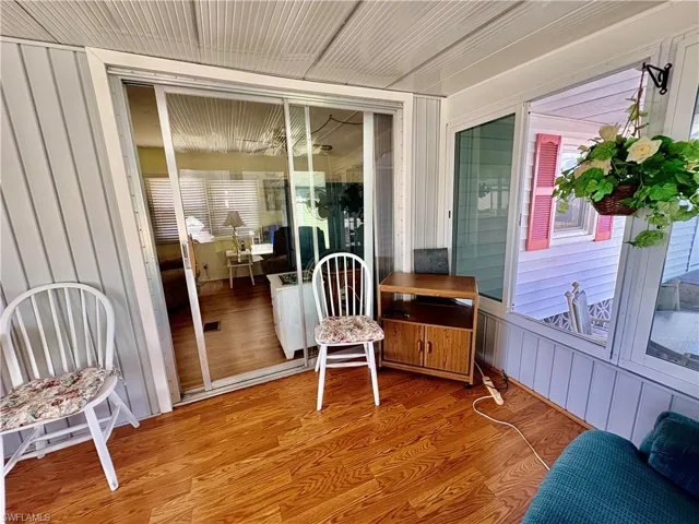Sunroom with wood finished floors