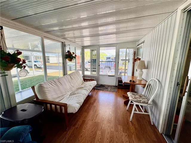 Sunroom with wood finished floors
