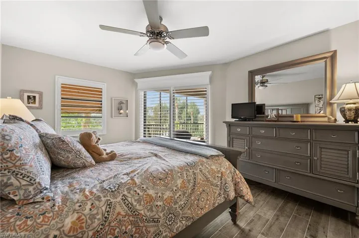 Spacious primary bedroom with slider leading to your patio