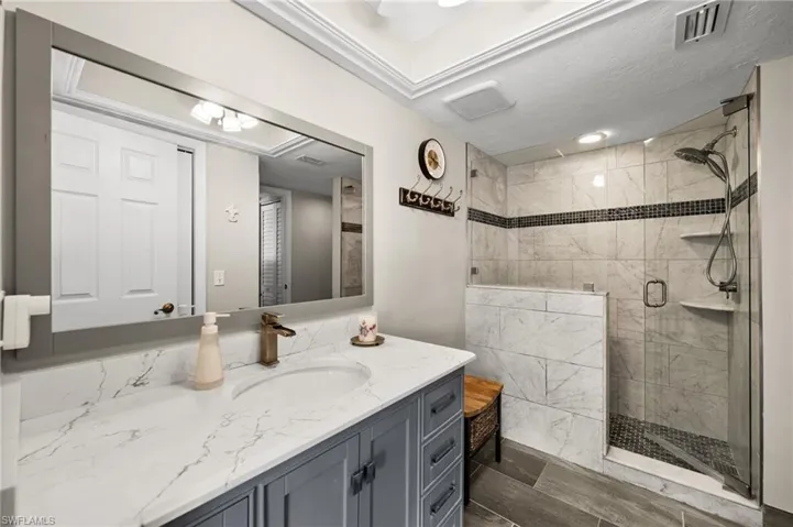 Completely updated second bath with modern finishes & glass-enclosed shower