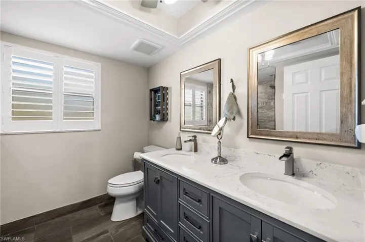 Completely updated Primary bath with dual sinks & glass-enclosed shower