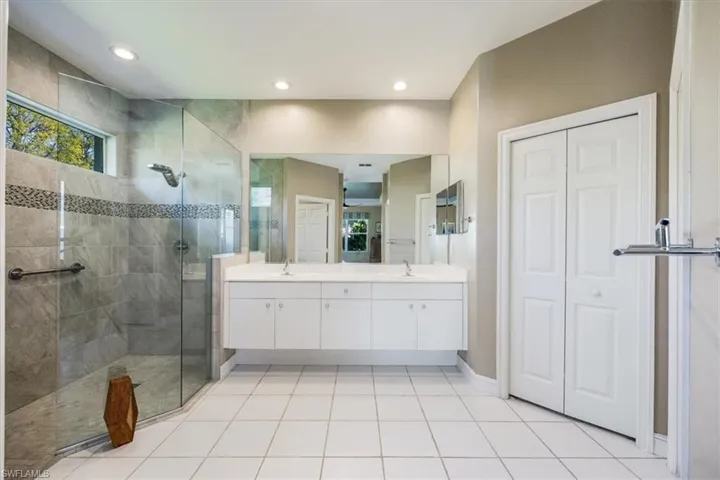 Lots of room and two master bedroom walk in closets make this a wonderful space to get ready for a perfect day in Naples