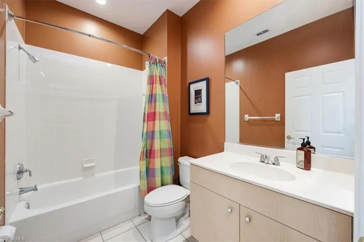 Full bath with shower/bath combo to host guests in private wing