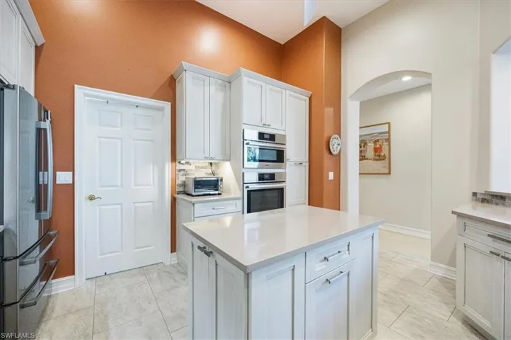 Custom pull out cabinets, nice pantry, laundry room right off of the kitchen and open views of living room and outdoor space