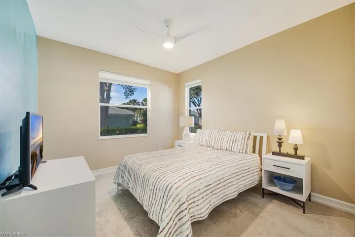3rd Bedroom coastal colored accent walls and light colored carpet