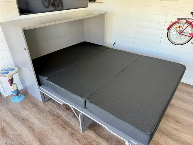 Cabinet turns into queen bed for guests
