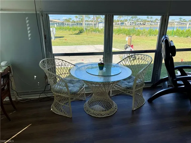 Dining space featuring wood finished floors and a residential view