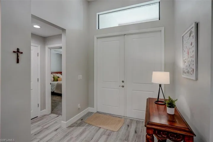 Foyer with light hardwood / wood-style flooring