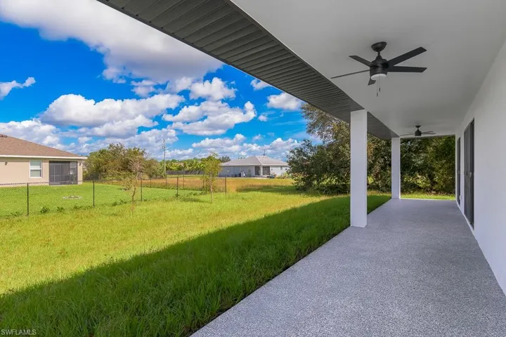 View of yard with ceiling fan