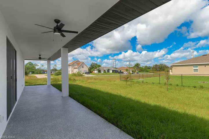View of yard with a patio and ceiling fan