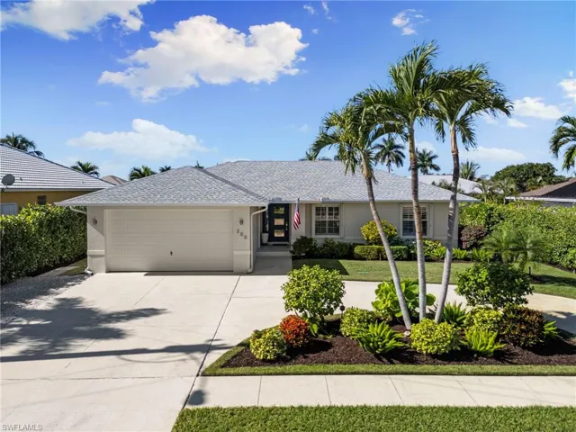 Single story home featuring driveway, stucco siding, roof with shingles, and an attached garage
