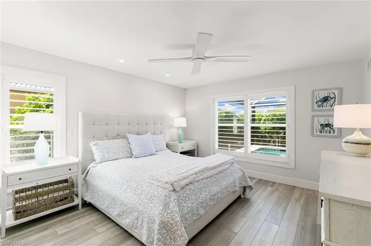 Bedroom featuring light wood-type flooring and a ceiling fan
