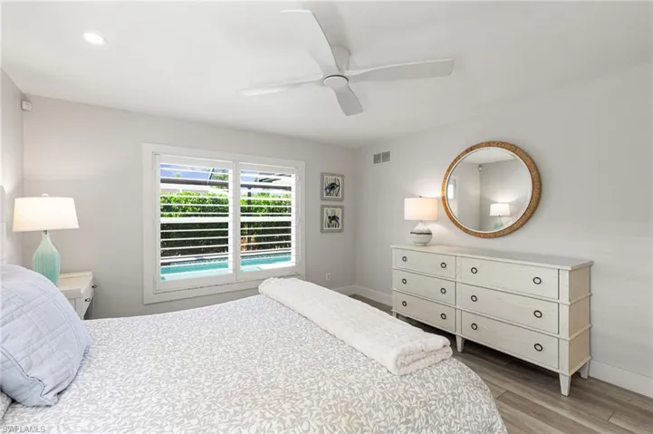 Bedroom featuring ceiling fan and light wood-type flooring