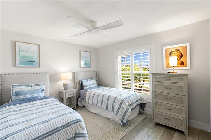 Bedroom with light wood-style flooring and ceiling fan