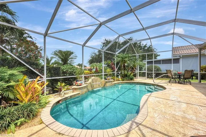 View of swimming pool with a patio and a lanai