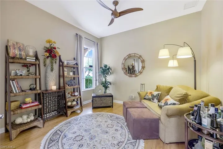 Living room featuring hardwood / wood-style flooring and ceiling fan