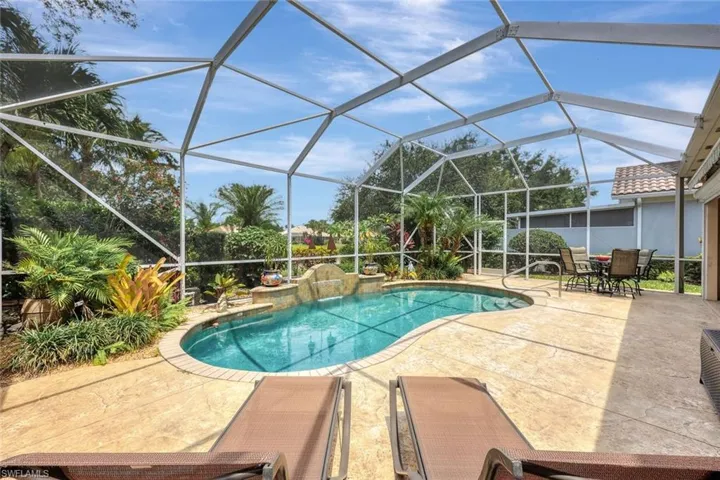 View of swimming pool featuring a patio and a lanai