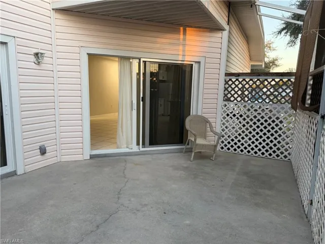 Bathroom featuring vanity, light tile patterned floors, and a tile shower