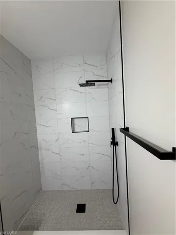Bathroom view of a marble finish shower