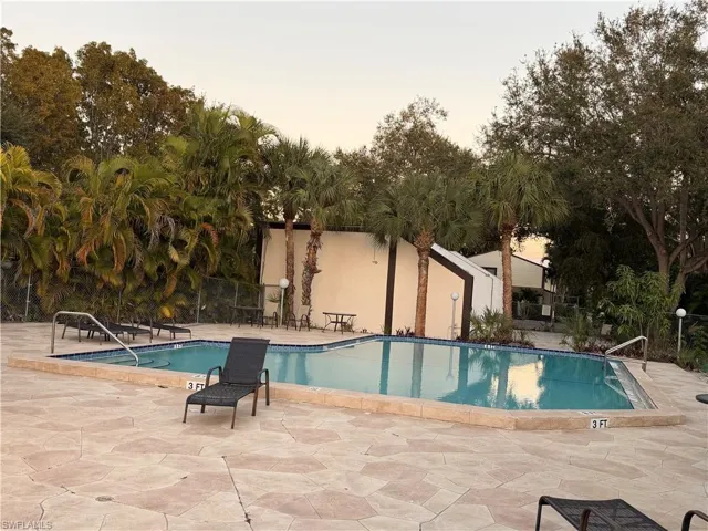 Community pool featuring a patio area