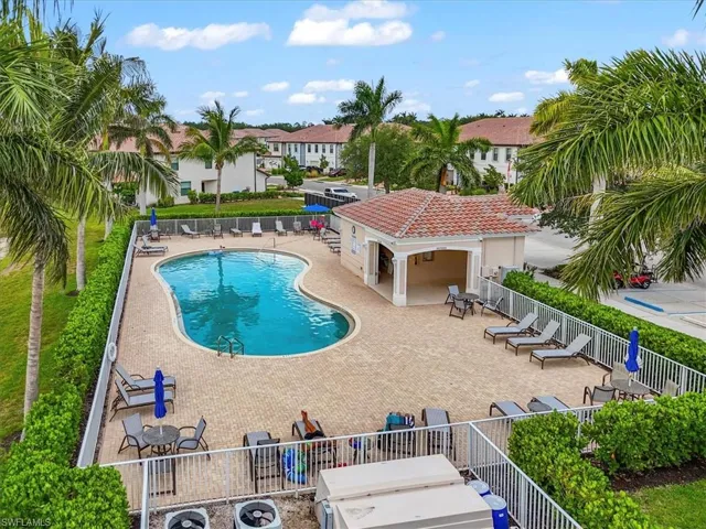 Community pool featuring a patio