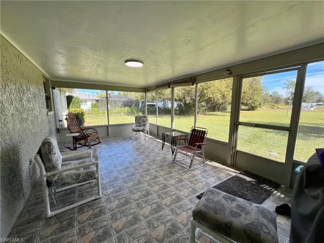 View of screened lanai with tile floors