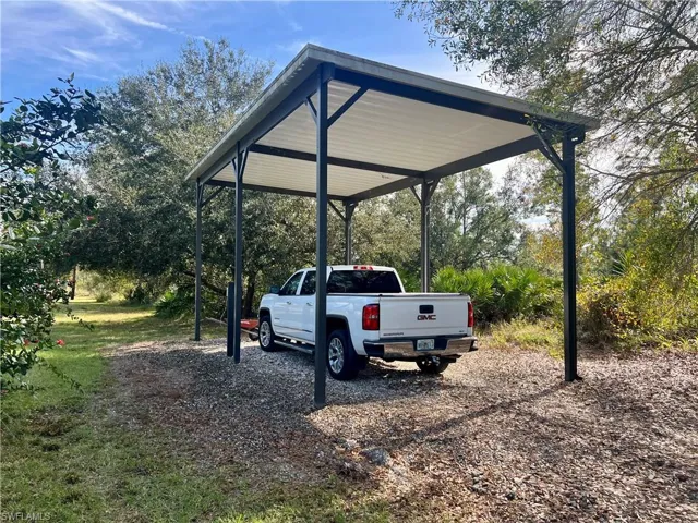 RV/Boat parking featuring a covered carport 12 foot high