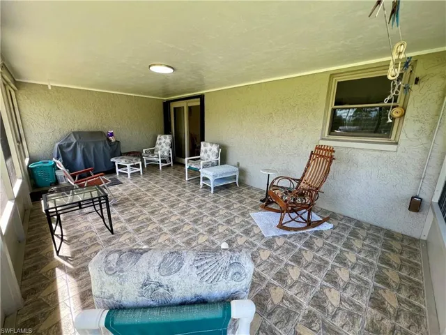 View of screened lanai with tile floors