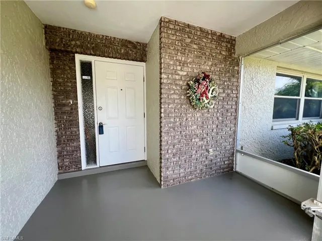 Screened front entryway.