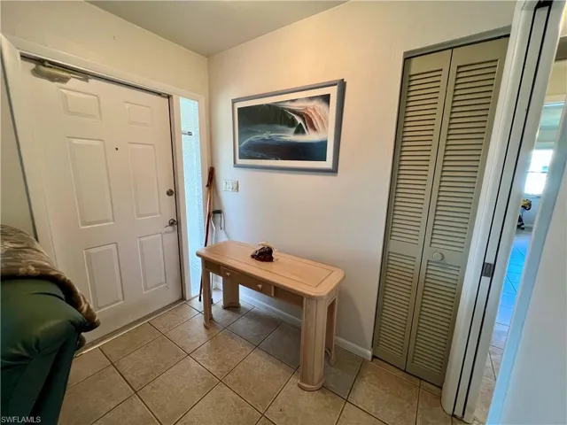Entryway featuring light tile patterned flooring