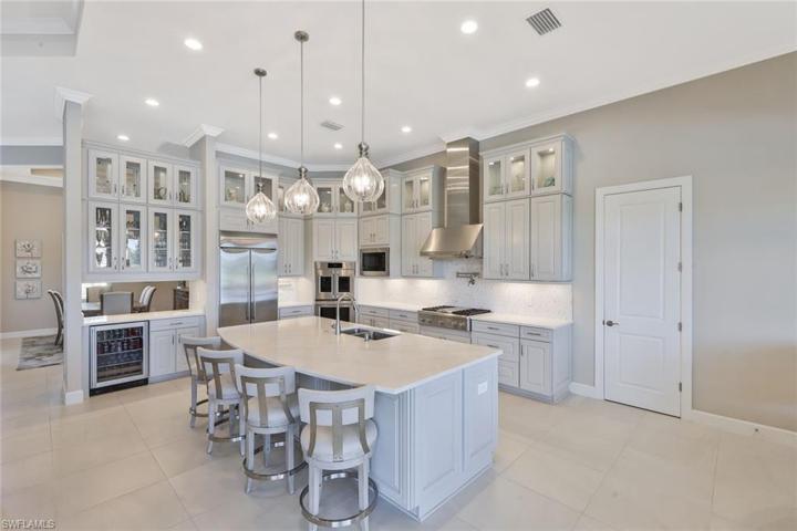 Kitchen with Built in Counter depth Frig! All appliances are GE Monogram. French door Frig, Unique French Door Electronic Convection (note top oven) and regular double oven system, under counter beverage center, Professional Gas Range 4 burner cook top + griddle, microwave, pot filler, 42" upper cabinets with 24" stacked upper glass door cabinets