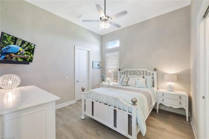 Bedroom 2 on main floor Wood floor, private bath plantation shutters.