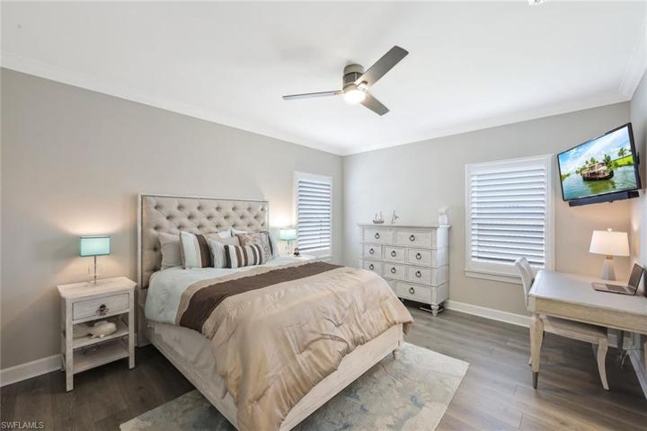 Bedroom 4 upstairs. Wood floor, Crown molding.