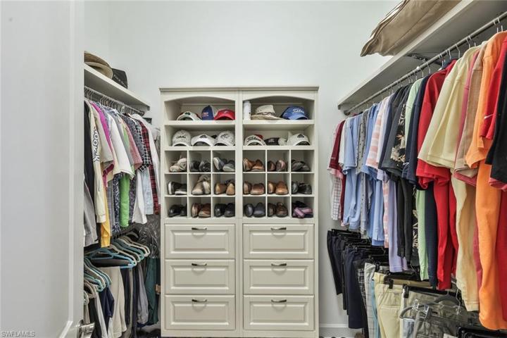 One view of 2 walk in closets in master suite.
