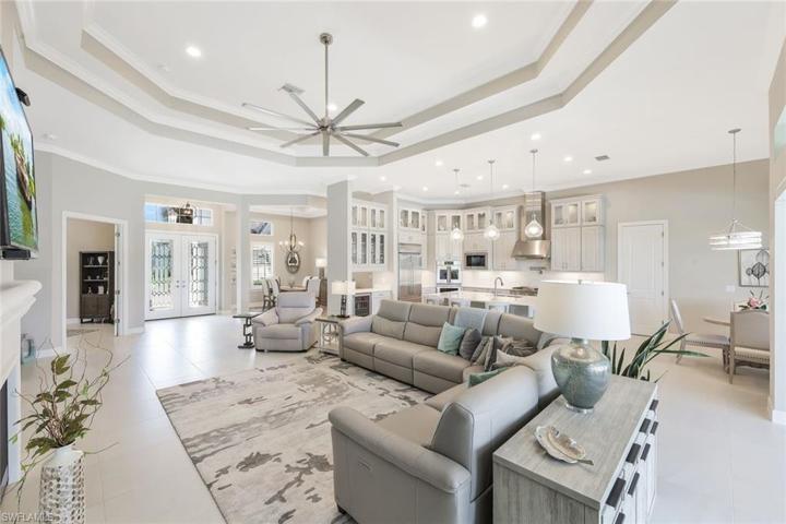 Grand Room facing front foyer, Dining Room and Kitchen.