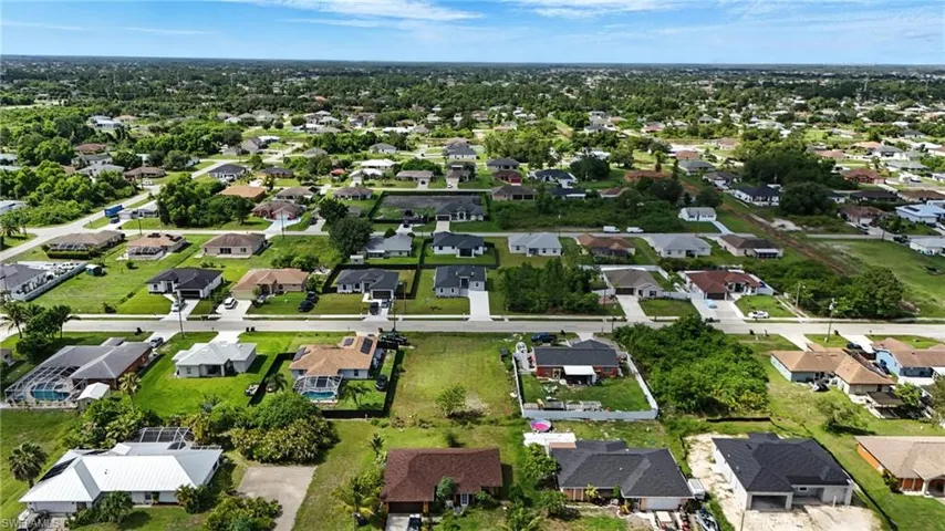 Aerial overview of property's location with nearby suburban area