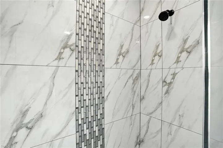 Bathroom view of a marble finish shower