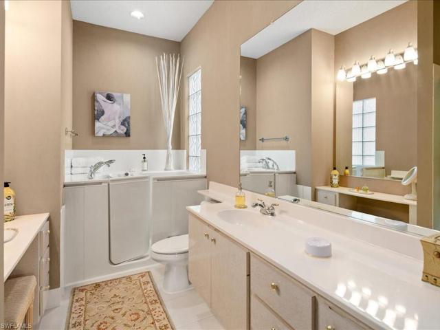 Master Bathroom (Hers) w/ Vanity Seating, Shower & Walk-In Hydrotherapy Tub