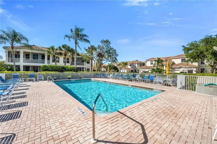 Community pool with lounge seating and clubhouse access just steps away.