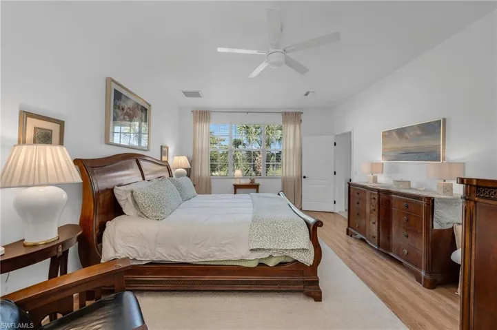 Another view of the spacious primary suite with room for a sitting area.