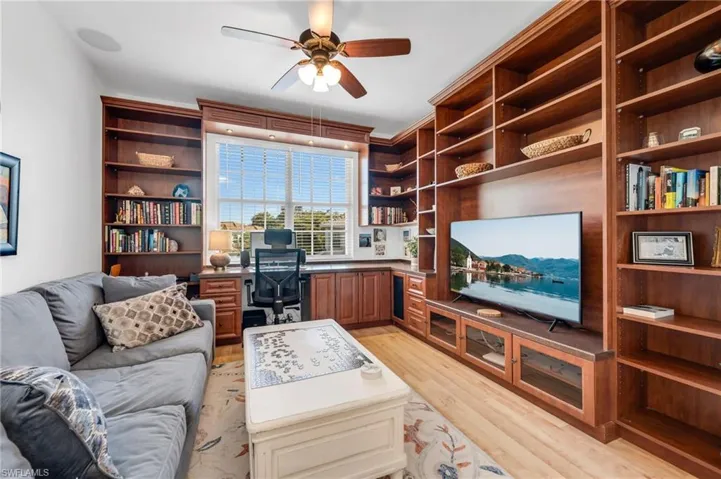 Charming bonus room with custom built-ins—perfect for a library, media room, or reading nook.