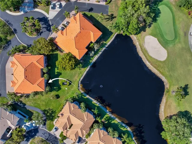 Aerial view showing the building’s proximity to the lake and golf course.