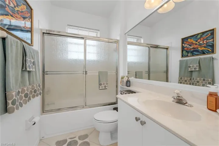 Guest bathroom with walk-in shower and plenty of natural light.