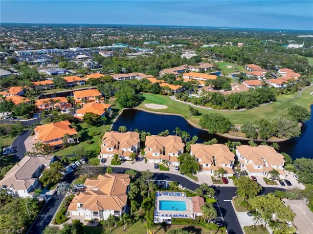 Wider aerial view showcasing the community layout and nearby amenities.
