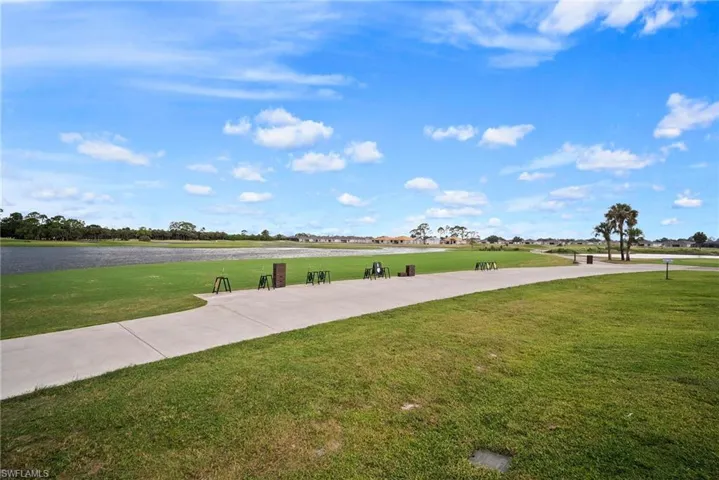 View of home's community with a lawn