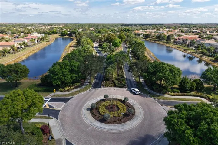 Aerial perspective of suburban area with a nearby body of water