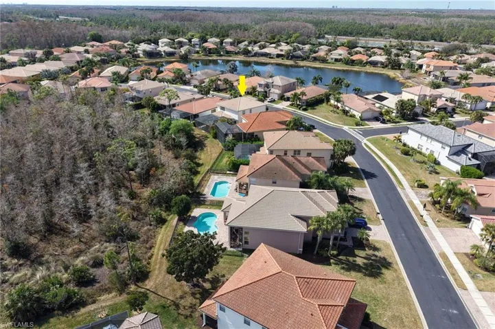 Aerial view of residential area with a nearby body of water