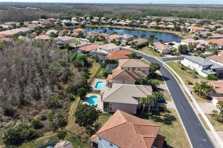 Aerial view of residential area with a nearby body of water