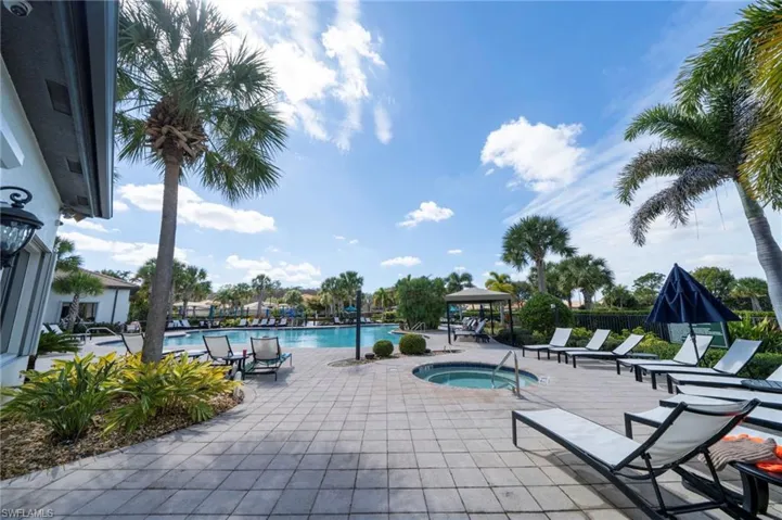Community pool with a gazebo, a patio, and a community hot tub