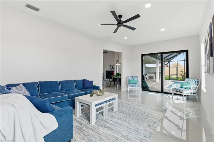 Living area featuring a ceiling fan, recessed lighting and ample natural light